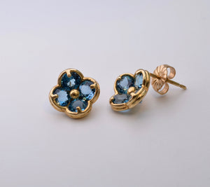 14K yellow gold flower-shaped post earrings with Blue Topaz