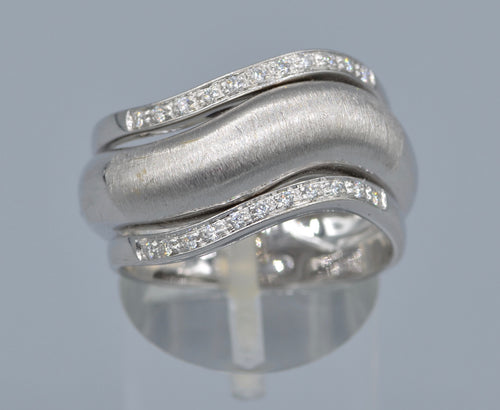 18K white gold ring with one center plain gold and two side diamond rings in one curved design