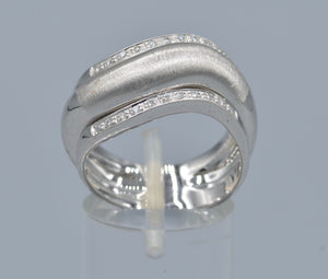18K white gold ring with one center plain gold and two side diamond rings in one curved design