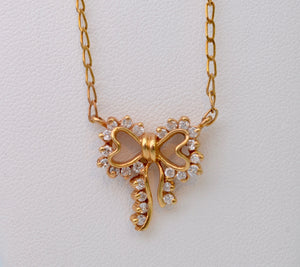 Diamond-studded Bow-Shaped Necklace in 14K Yellow Gold