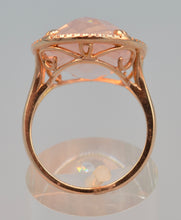 14K rose gold ring with transparent rose quartz framed with diamonds