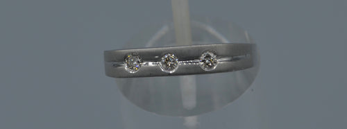 14K white gold wedding band with three Diamonds on top