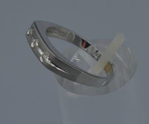 14K white gold wedding band with three Diamonds on top