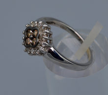 14K white gold ring with four center Brown Diamonds framed with white Diamonds