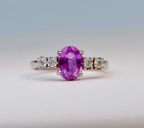 14K white gold ring with one oval Pink Sapphire and 4 Diamonds