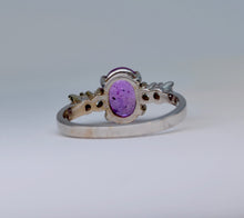 14K white gold ring with one oval Pink Sapphire and 4 Diamonds