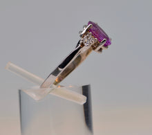 14K white gold ring with one oval Pink Sapphire and 4 Diamonds