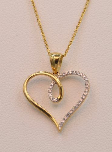14K yellow gold heart-shaped pendant, half set with diamonds