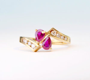 14K yellow gold ring with 2 pear-shaped Rubies and 8 side Diamonds