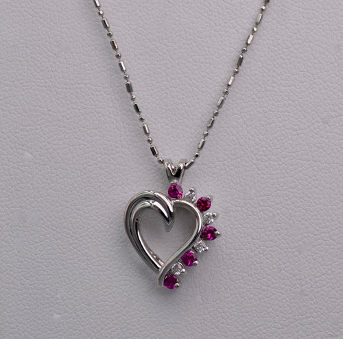 14K white gold heart-shaped pendant with Rubies and Diamonds